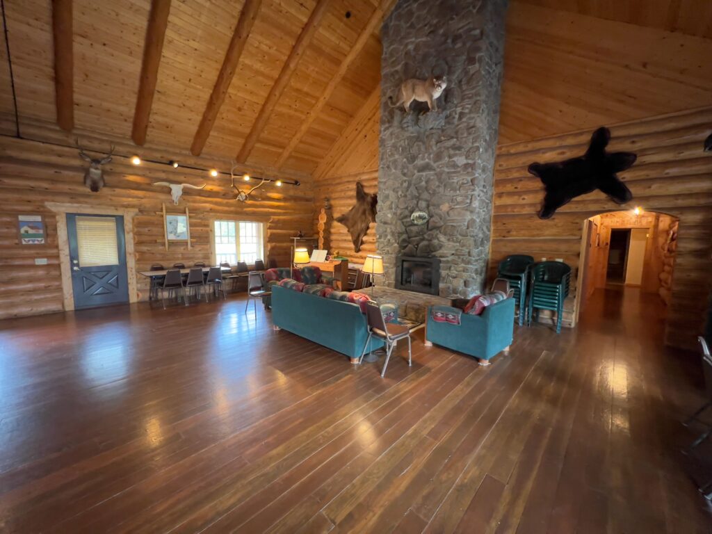 Great room with log construction and lodge furnishings