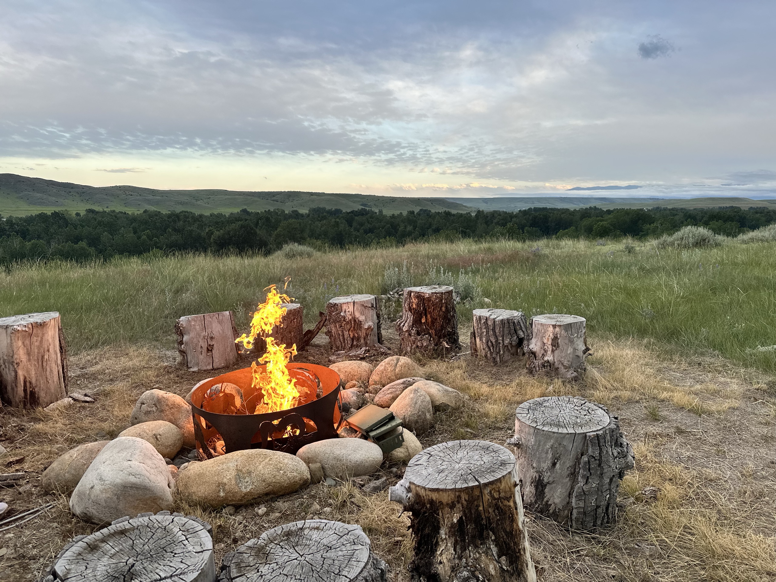Firepit at sunset overlooking the Montana prairie