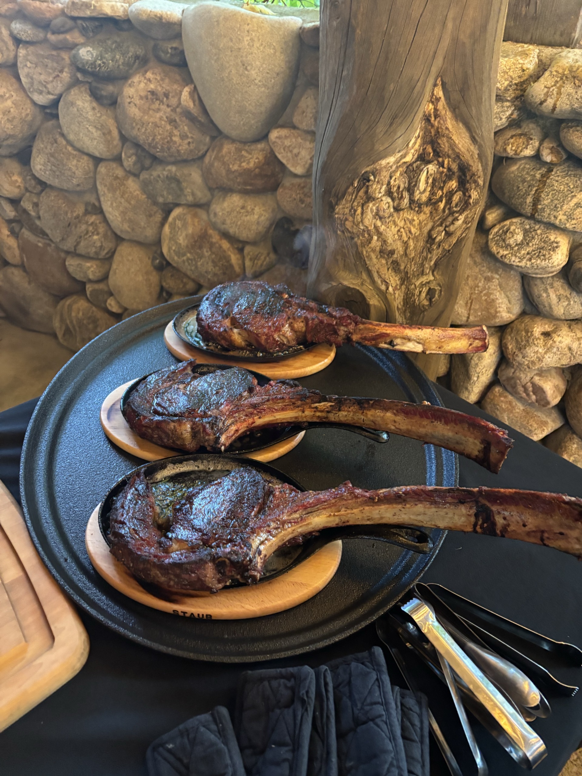 Smoked tomahawk chops on the stone hearth