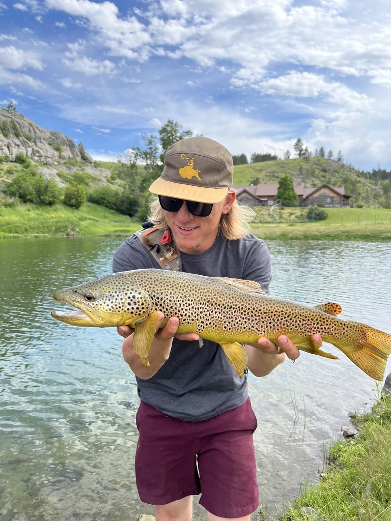 Spring creek with the lodge in the background