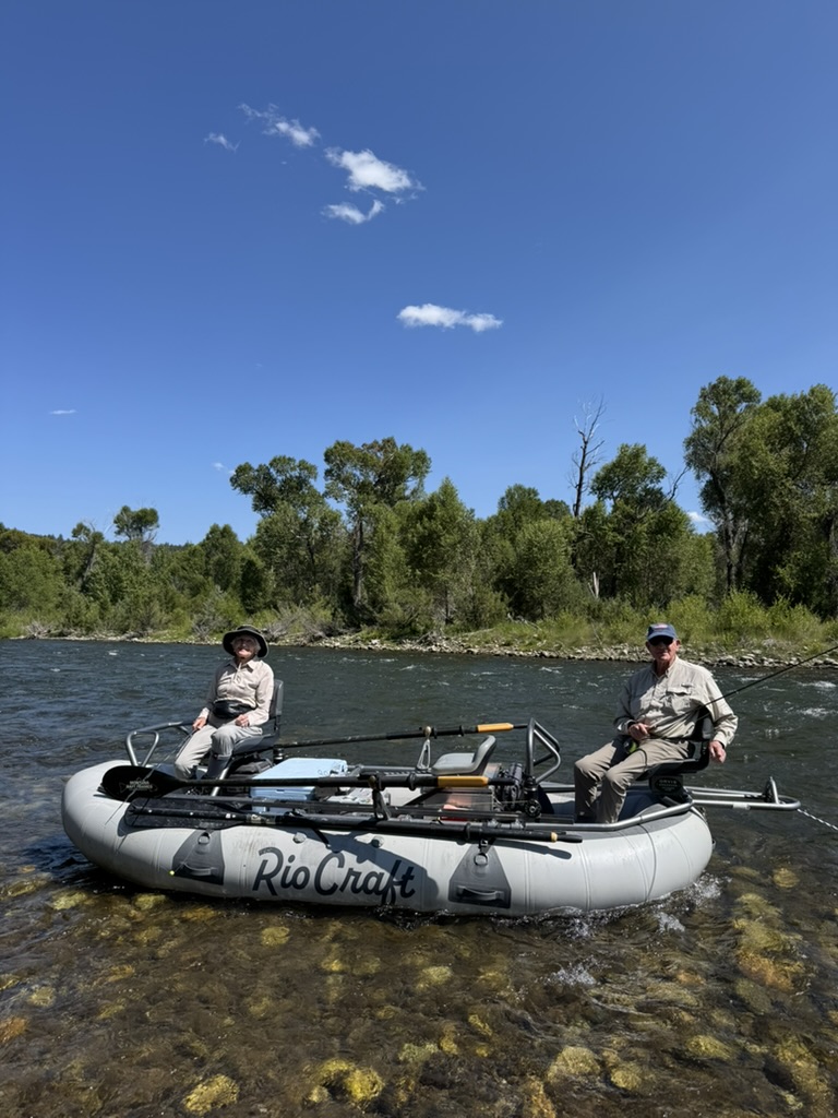 Guide on the oars of a Montana fly fishing raft