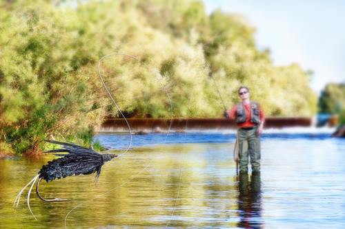 Artistic fly casting on a golden river